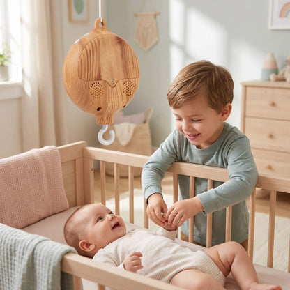 mobile musical bebe frere joue bebe berceau bois