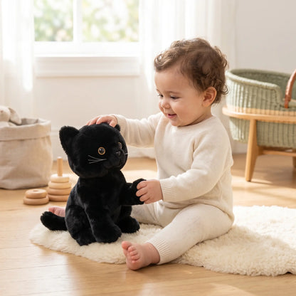 peluche chat noir realiste assis bebe